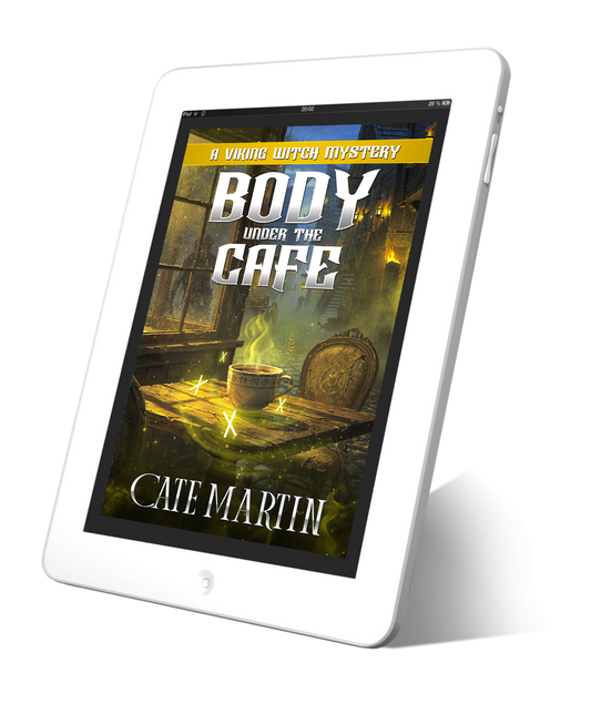 Tablet displaying the book cover of 'Body Under the Cafe' by Cate Martin on a white background