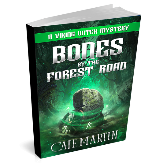 Book titled 'Bones by the Forest Road' by Cate Martin with a green and black cover.