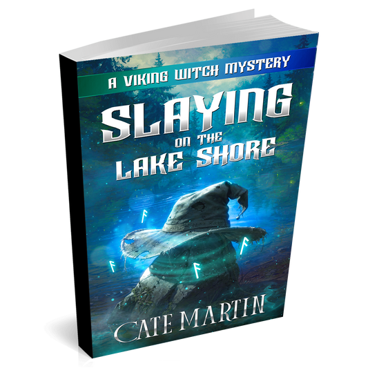 Book titled 'Slaying on the Lake Shore' by Cate Martin with a Viking hat design on the cover.